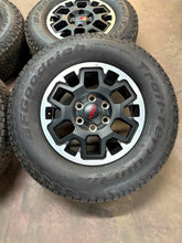 Load image into Gallery viewer, Set of 4 OEM Takeoff &#39;24-&#39;25 Toyota Tacoma TRD Wheels 265/70R17 Trail Terrain LT
