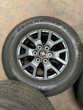 Load image into Gallery viewer, Set of OEM 17&quot; &#39;24-&#39;25 Toyota Tacoma Dark Charcoal Wheels on 245/70R17 Tires LT
