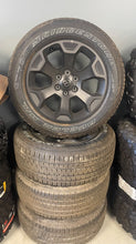 Load image into Gallery viewer, Set of Four OEM Black '19-'26 RAM 1500 Wheels 275/55R20 Bridgestone Alenza Tires
