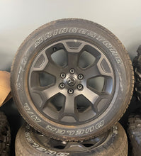 Load image into Gallery viewer, Set of Four OEM Black '19-'26 RAM 1500 Wheels 275/55R20 Bridgestone Alenza Tires
