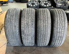 Load image into Gallery viewer, Set of 4 Used '22-'26 Toyota Tundra TRD Black 20" OEM Wheels Falken 265/60R20 LT
