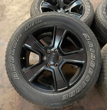 Load image into Gallery viewer, Set of 4 Used 20&quot; Black &#39;19-&#39;24 RAM 1500 Rims on 275/55R20 Bridgestone Tires LT
