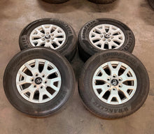 Load image into Gallery viewer, Set of Lightly Used '24-'26 Toyota Tacoma 17" OEM Rims 245/70R17 Goodyear HT LT
