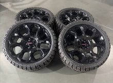 Load image into Gallery viewer, Set of New OEM 24&quot; &#39;00-&#39;25 GMC Sierra 1500 Black Wheels on 33/12.50R24 Kenda RT
