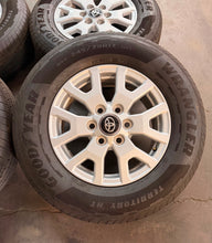Load image into Gallery viewer, Lightly Used Set of '24-'26 Toyota Tacoma 17" OEM Rims 245/70R17 Goodyear HT LT
