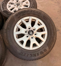 Load image into Gallery viewer, Set of Lightly Used '24-'26 Toyota Tacoma 17" OEM Rims 245/70R17 Goodyear HT LT
