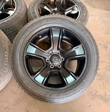 Load image into Gallery viewer, Set of Used 20" Black '19-'26 RAM 1500 2676 Wheels 275/55R20 Bridgestone H/L LT
