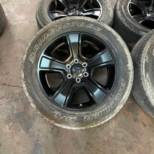 Load image into Gallery viewer, Set of 4 Used '19-'26 RAM 1500 Black OEM Wheels 275/55R20 Bridgestone H/L OWL LT
