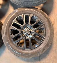 Load image into Gallery viewer, Set of 4 Used 20" '22-'26 Toyota Tundra OEM Black Wheels on 265/60R20 Arroyo LT
