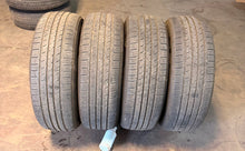 Load image into Gallery viewer, Set of 4 Used 20" '22-'26 Toyota Tundra OEM Black Wheels on 265/60R20 Arroyo LT
