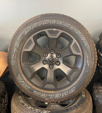 Load image into Gallery viewer, Set of Four OEM Black &#39;19-&#39;25 RAM 1500 Wheels 275/55R20 Bridgestone Alenza Tires
