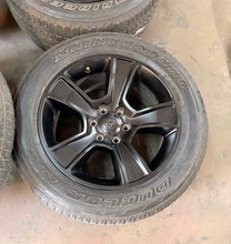 Load image into Gallery viewer, Set of Used 20" Black '19-'26 RAM 1500 2676 Wheels 275/55R20 Bridgestone H/L LT
