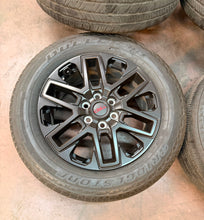 Load image into Gallery viewer, Set of Used 20" OEM '22-'26 Toyota Tundra Black Wheels 265/60R20 Bridgestone LT
